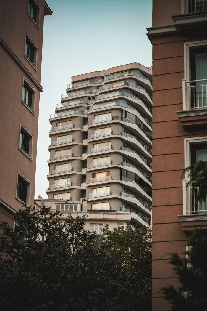 Contemporary skyscraper design surrounded by classic buildings in İstanbul, Türkiye.